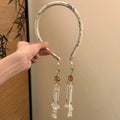 Elegance Without Effort – Tassel Faux‑Earring Headban