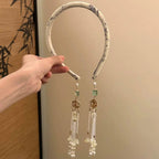 Elegance Without Effort – Tassel Faux‑Earring Headban
